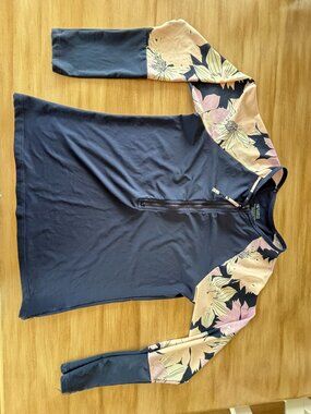 Carve Designs Navy Rash Guard with Lilac Floral Sleeves